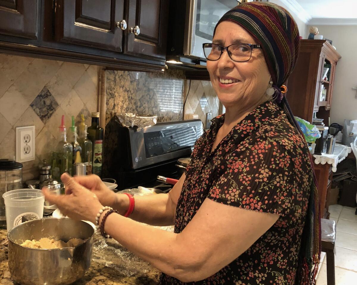 Maria de la Luz Arellano, making gorditas at her home in Anaheim in 2018.