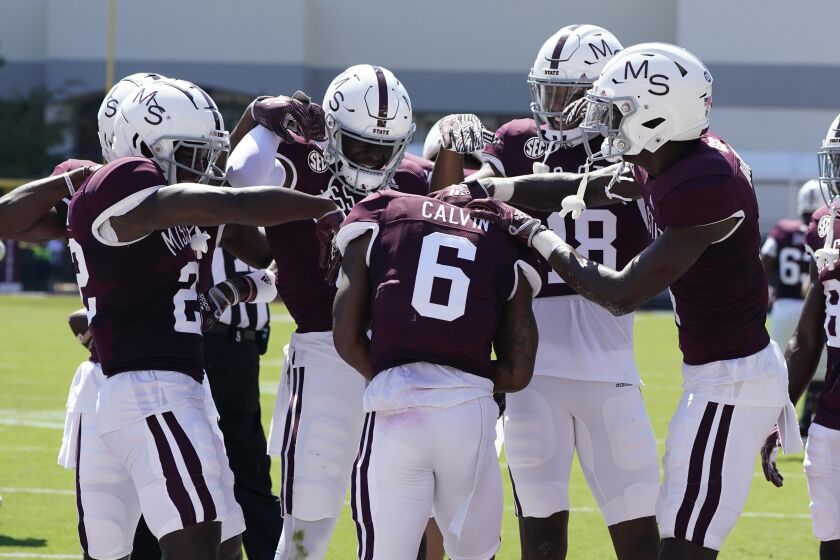 Mississippi State wide receiver Jamire Calvin (6) is congratulated by teammates following his two-yard touchdown reception during the first half of an NCAA college football game against Bowling Green in Starkville, Miss., Saturday, Sept. 24, 2022. (AP Photo/Rogelio V. Solis)