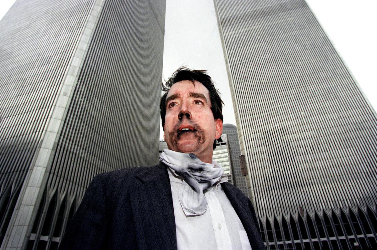 Brian Rolford stands outside the World Trade Center after walking down from the 105th floor following the bombing of the World Trade Center on Feb. 26, 1993.