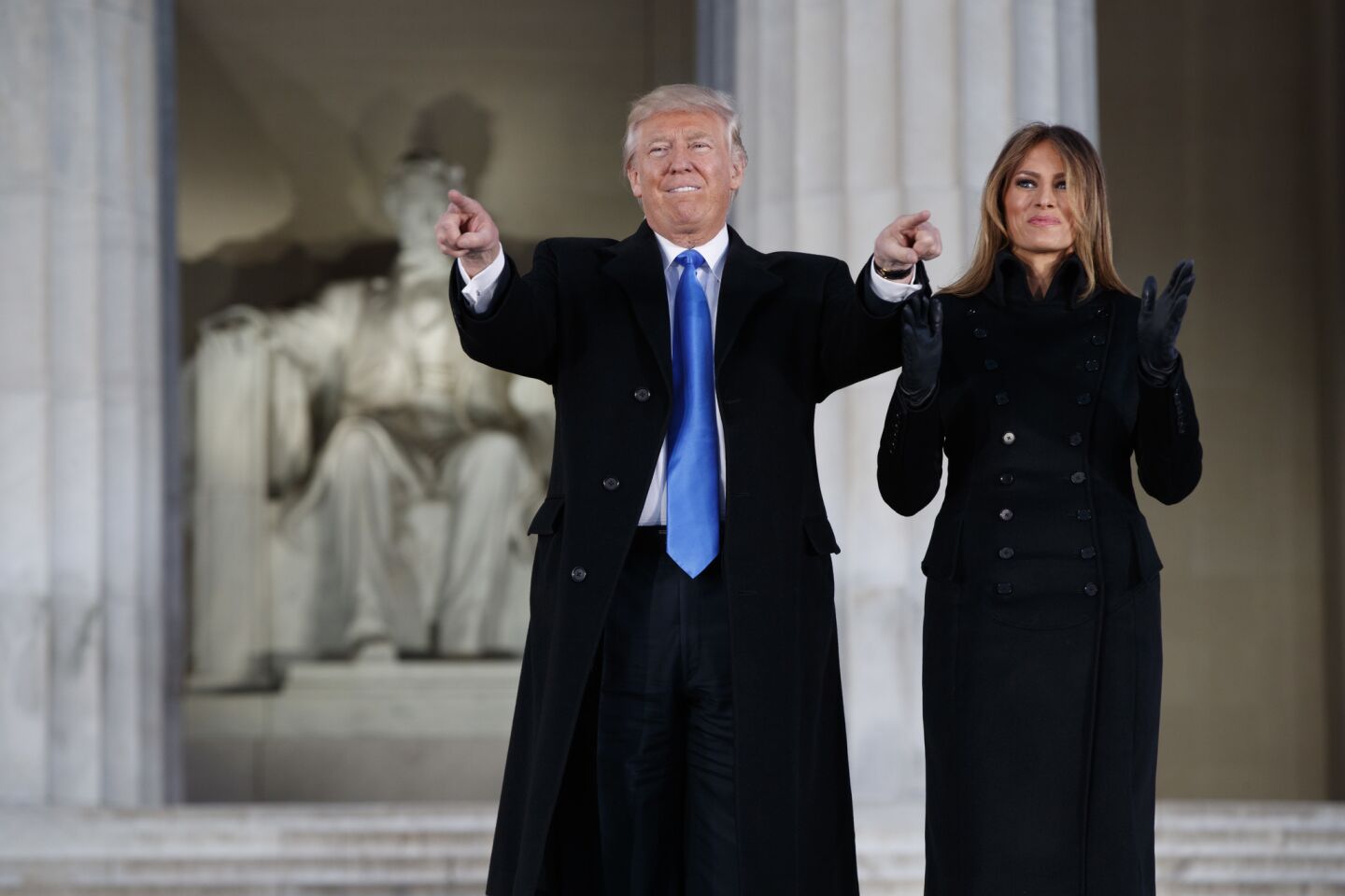 President-elect Donald Trump, left, and his wife, Melania Trump, arrive to the "Make America Great Again Welcome Concert" at the Lincoln Memorial on Thursday.