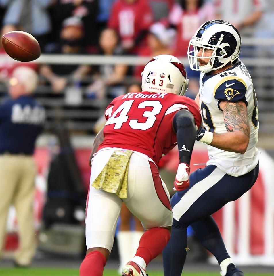 Rams tight end Tyler Higbee catches a touchdown pass in front of Cardinals linebacker Haason Reddick.