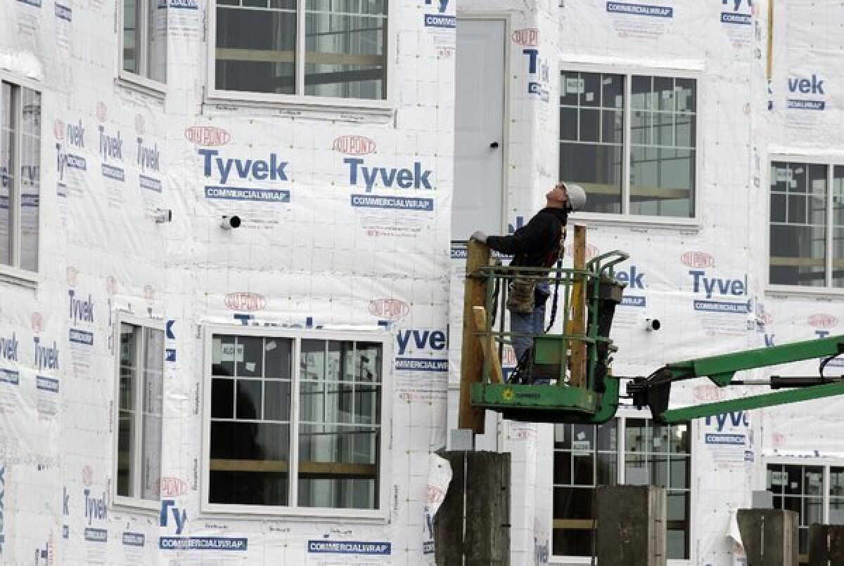 Housing starts dropped last month but remained solidly above year-ago levels. A construction worker at a new home under construction in Chicago.