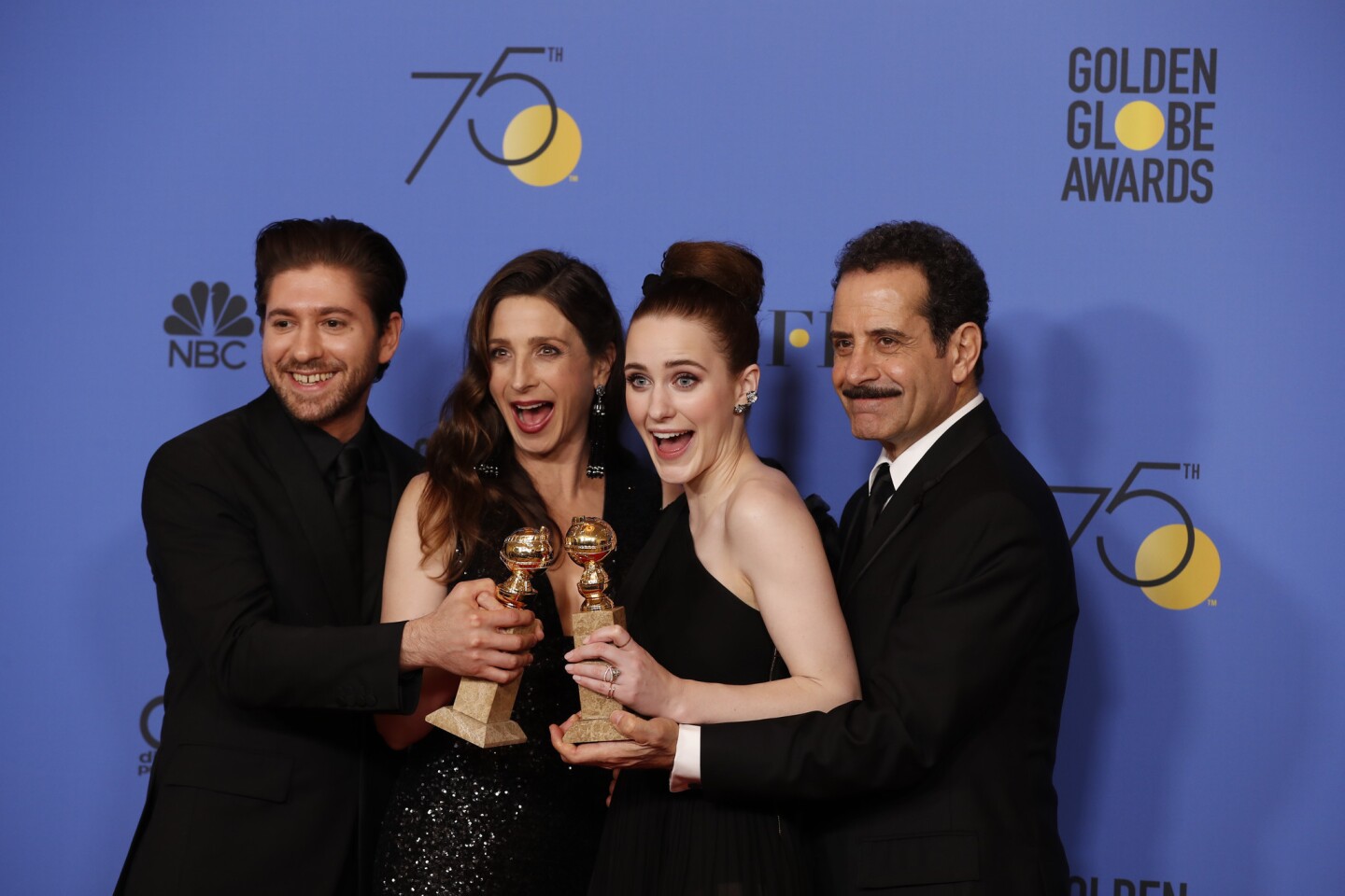 Cast members Michael Zegen, left, Marin Hinkle, Rachel Brosnahan and Tony Shalhoub with their Golden Globe for television series musical or comedy for "The Marvelous Mrs. Maisel."