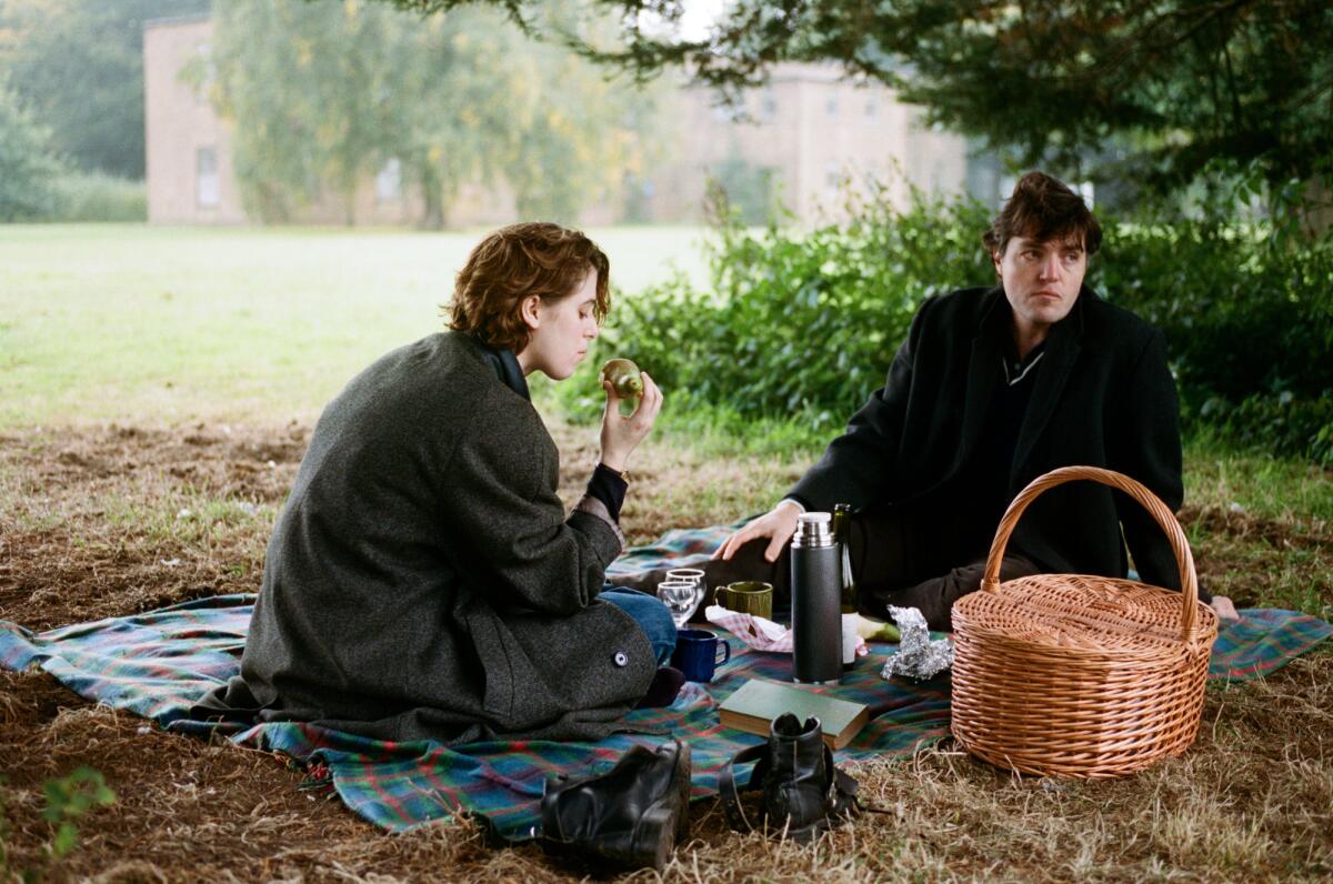 Honor Swinton Byrne, left, and Tom Burke in a scene from "The Souvenir."