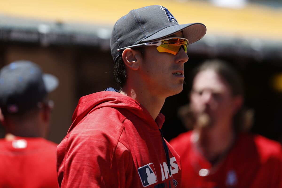 Tim Lincecum watches from the Angels dugout during a game in June.