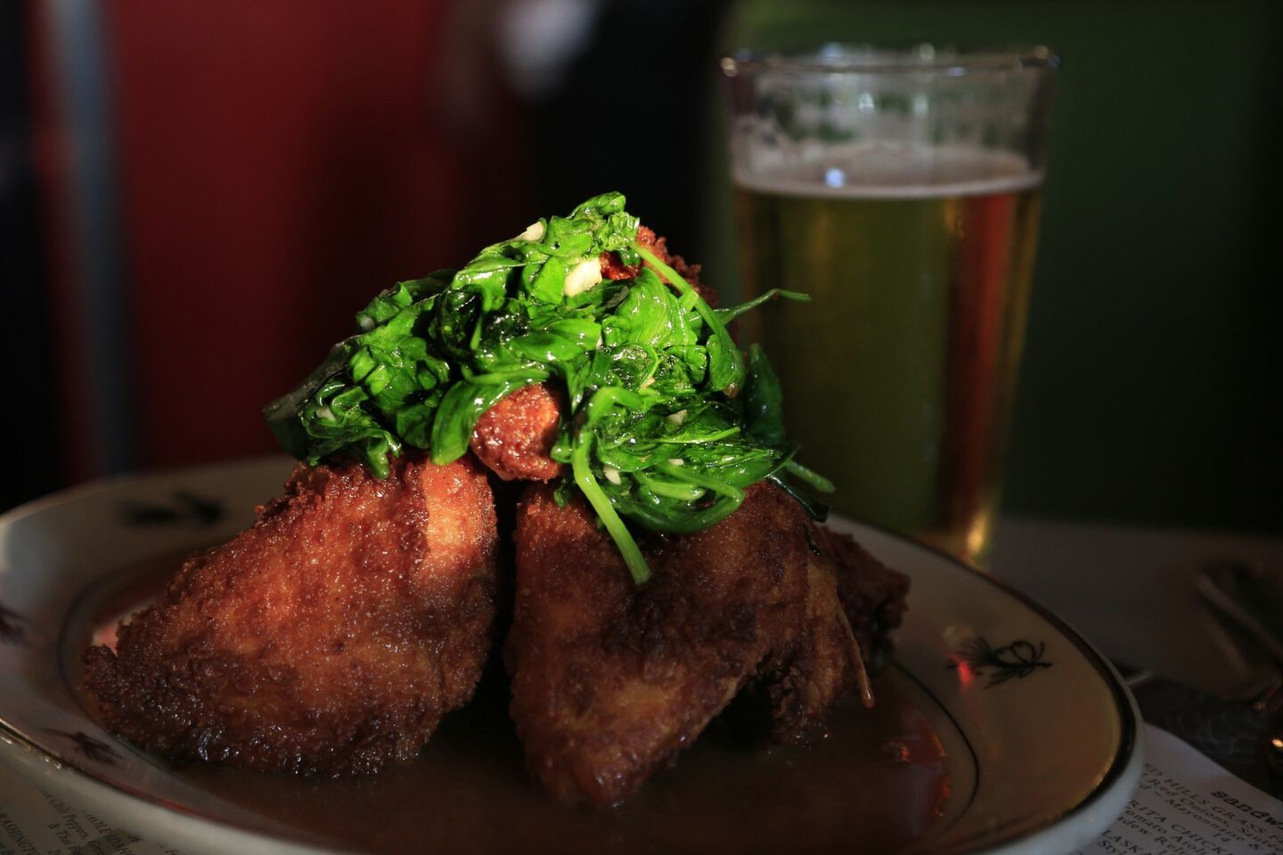Southern fried chicken topped with sauteed spinach is served with brown gravy at the Steelhead Diner at Pike Place Market off Post Alley.