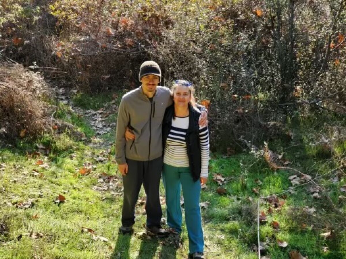West Hollywood native Max Buydakov, right, stands next to his mother, Larisa Pereshivaylova at an unknown park.