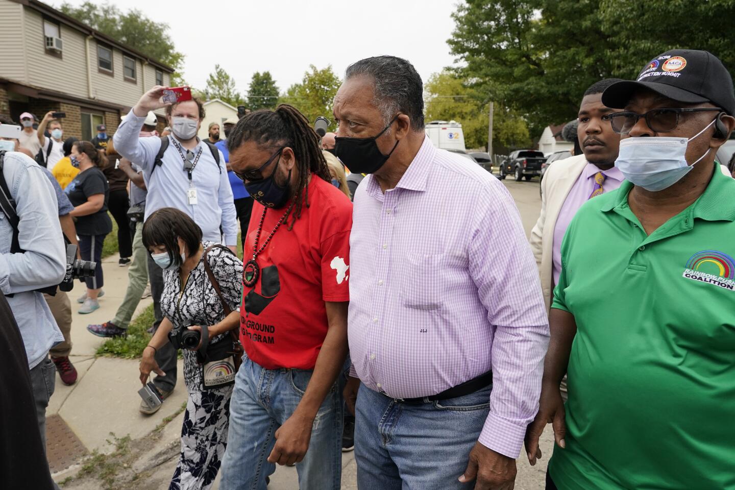 The Rev. Jesse Jackson participates in a community gathering at the site of Jacob Blake's shooting in Kenosha, Wis.