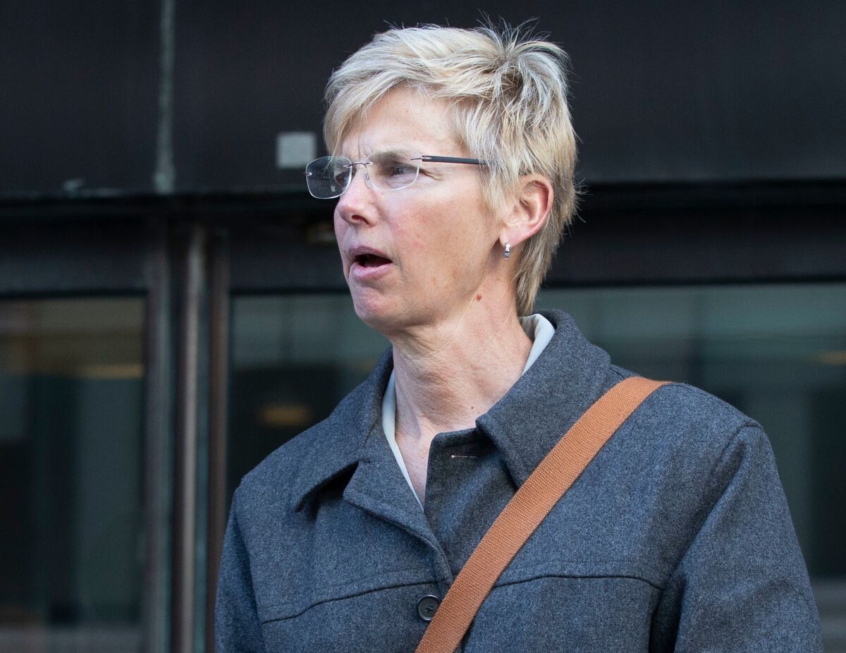Former USC athletic administrator Donna Heinel walks out of a federal courthouse in Boston in March 2019.