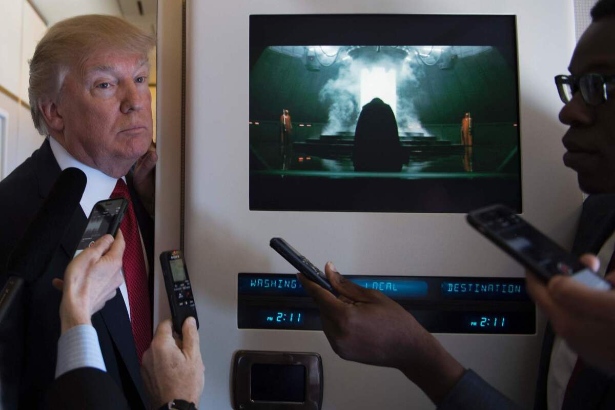 President Trump speaks to the media April 6 on Air Force One, shortly after a meeting of his national security team to discuss military action against Syria.