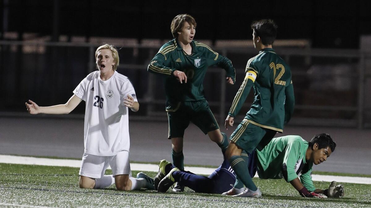 Zac Ingalls (12) and Dustin Vorhees, left, led the Edison High boys' soccer team to a second straight Sunset League championship in 2017-18.