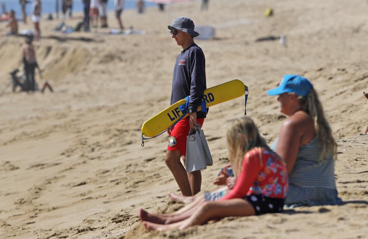 A Newport Beach lifeguard watches everyone.