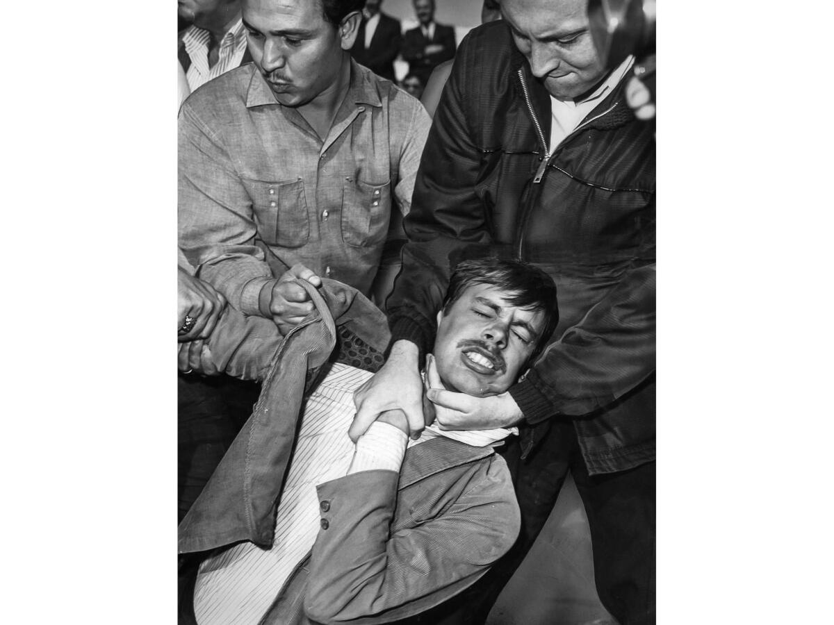 March 10, 1965: U.S. deputy marshals forcibly remove a demonstrator from an entrance to the Federal Building parking lot in L.A.