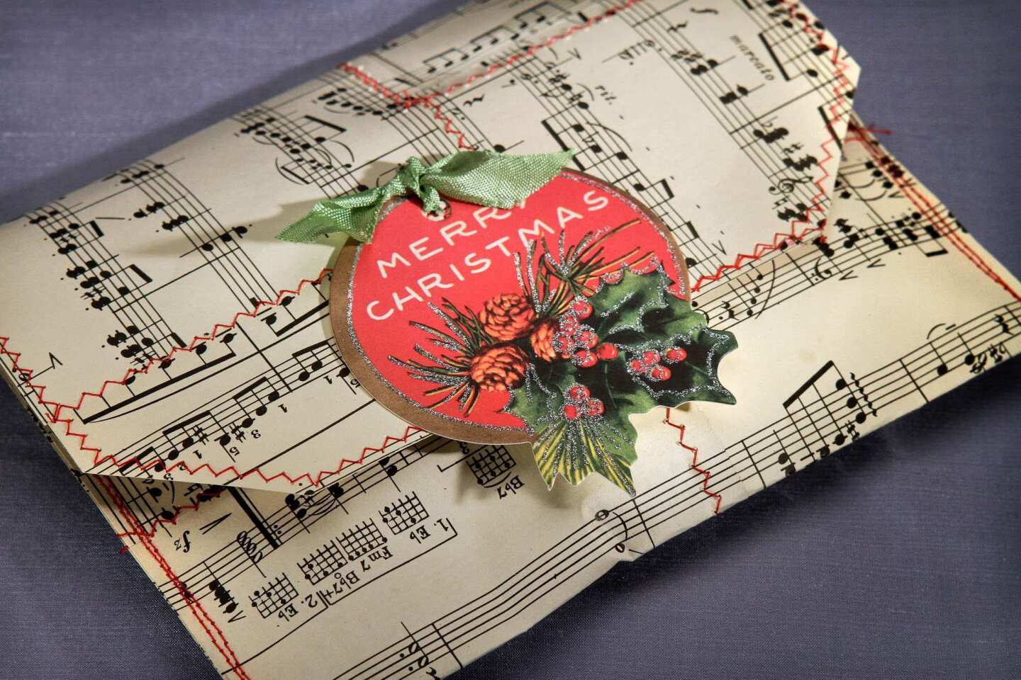 Vintage sheet music is cut and sewn patchwork-style into an envelope shape, just right for delivering a single cookie.