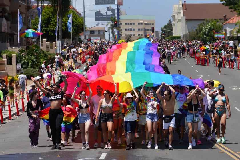 San Diego, CA - July 15: At Pride Parade in San Diego, participants carry the large Pride flag down Sixth Avenue towards Balboa Park on Saturday, July 15, 2023 in San Diego, CA. (Nelvin C. Cepeda / The San Diego Union-Tribune)