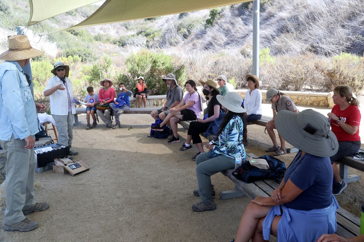 Crystal Cove State Park volunteer Dana Hunter, second from left, at a "Hiking 101" Class Tuesday at the park.