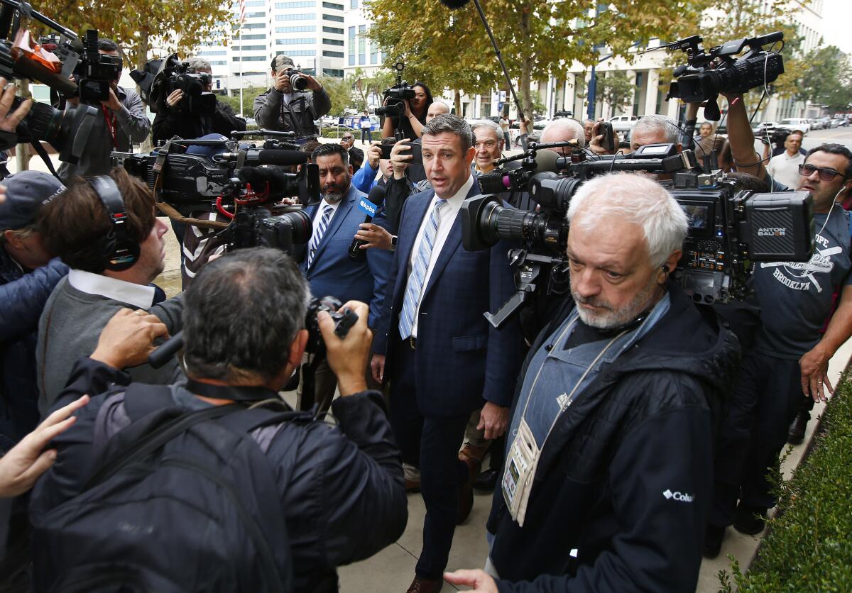 Rep. Duncan Hunter arrives at federal court in San Diego to change his plea in a sweeping campaign finance investigation.