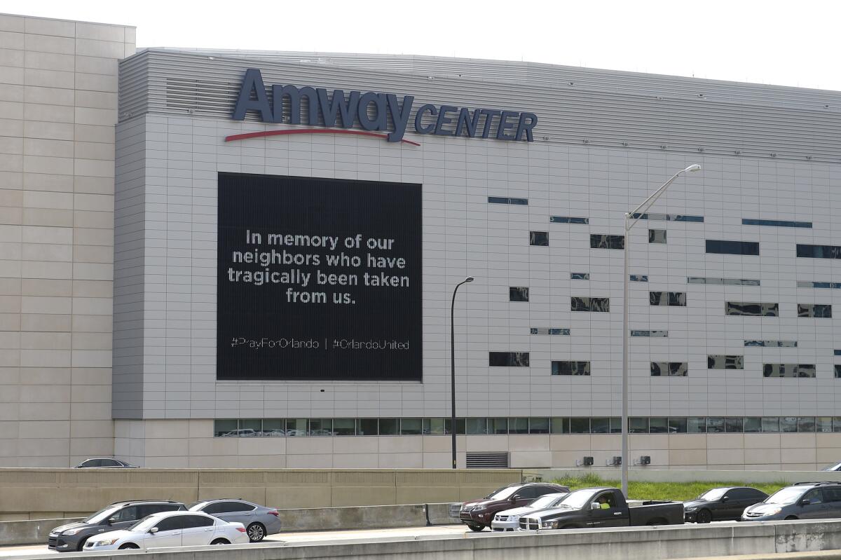 Condolences for the victims of the Pulse shooting are displayed on an electronic message board outside the Amway Center on Monday.