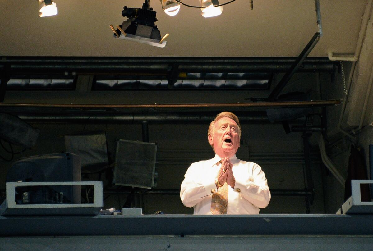 Vin Scully sings "Take me out to the ballgame" during a game between the Dodgers and Arizona Diamondbaclks at Dodger Stadium in September 2011.