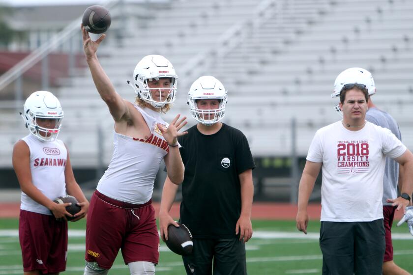 Ocean View High School quarterback throws during practice at the Seahawks football field on campus in Huntington Beach on Wednesday, Aug. 7, 2019.