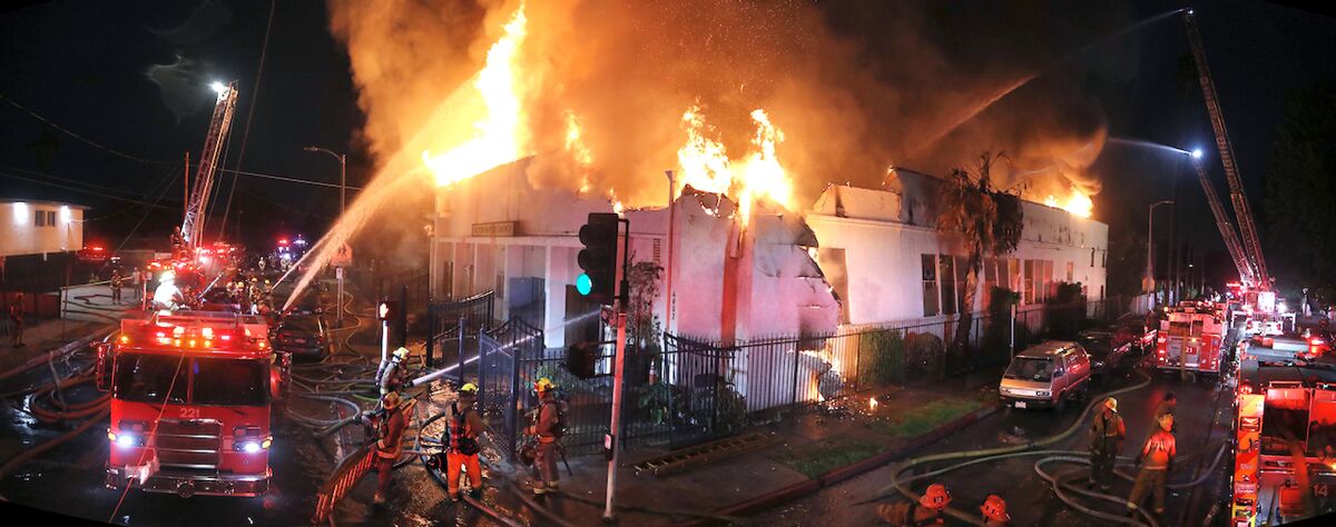 Los Angeles Fire Department crews battle the flames at the Victory Baptist Church.