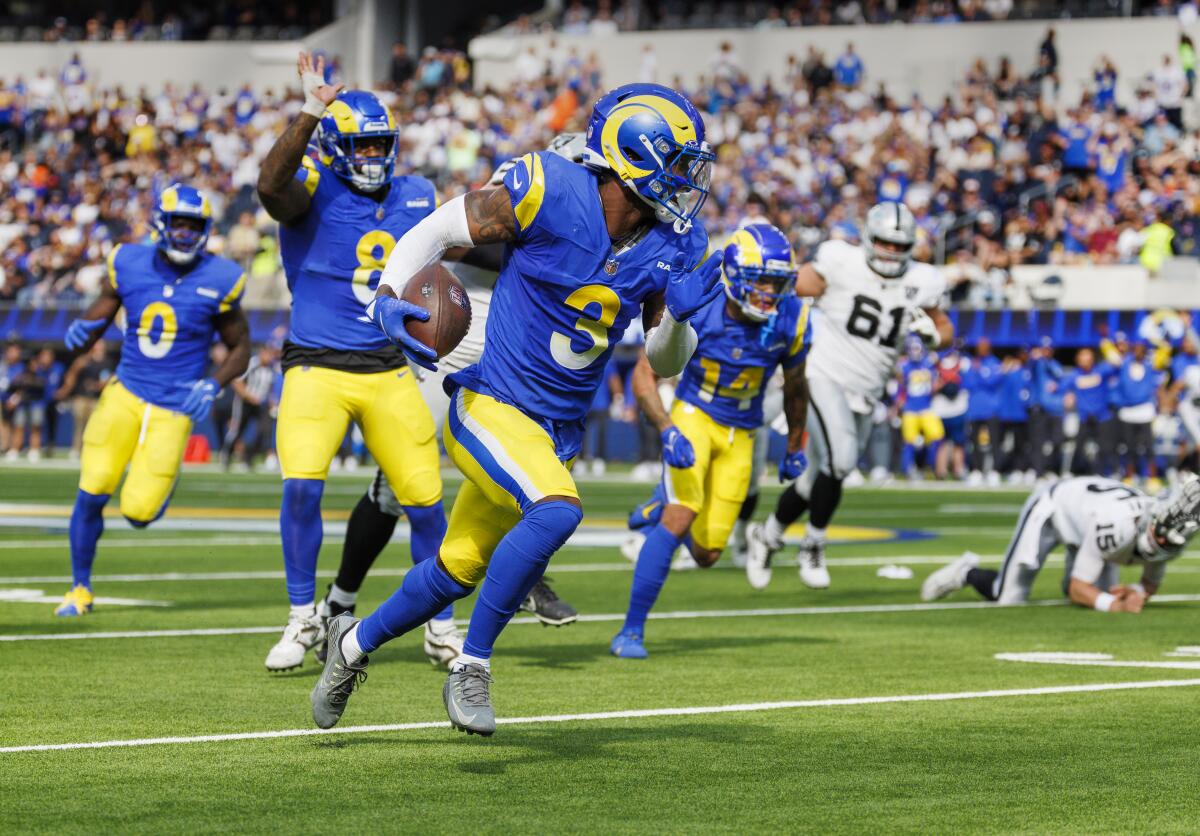 Rams safety Kam Curl scores on a 33-yard fumble return in the second quarter of a 20-15 victory over the Raiders.