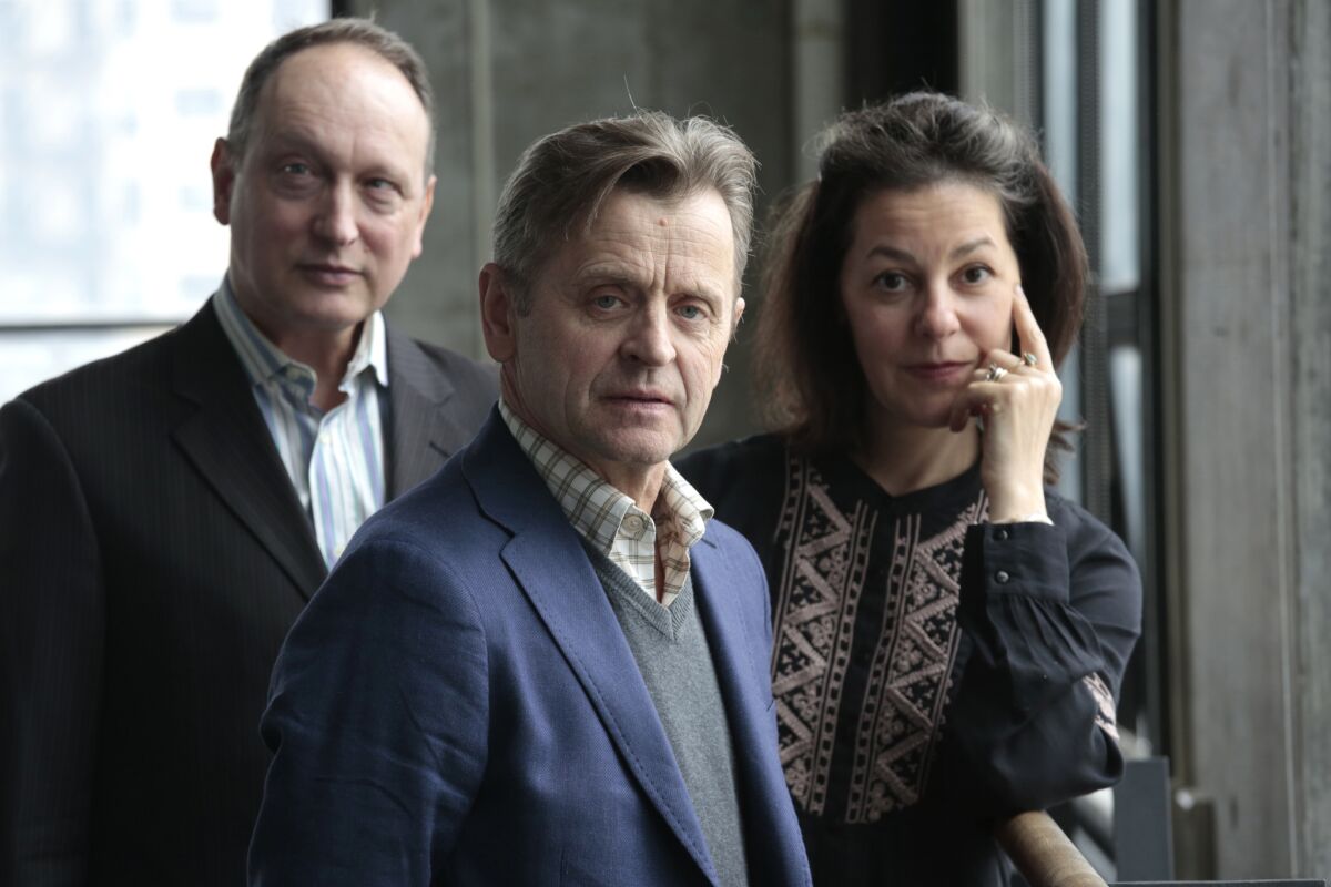 Mikhail Baryshnikov, center, will star in the new play "Man in a Case," co-directed by Paul Lazar, left, and Annie-B Parson, right. They are seen at the Baryshnikov Arts Center in New York.