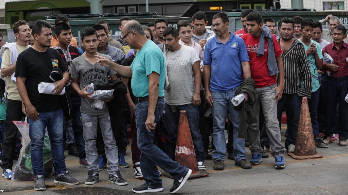 Immigrants are directed to the Central Station terminal after they were released from federal custody.