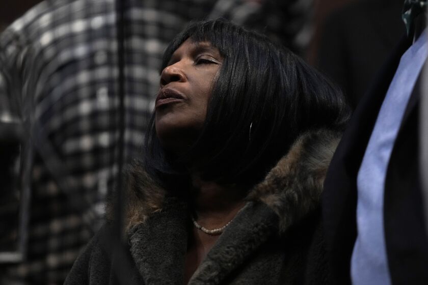 RowVaughn Wells, mother of Tyre Nichols, pauses as she listens during a news conference about the death of her son Tuesday, Jan. 31, 2023, at Mason Temple in Memphis, Tenn. A funeral service for Nichols, who died after being beaten by Memphis police officers during a traffic stop, is scheduled to be held on Wednesday. (AP Photo/Jeff Roberson)