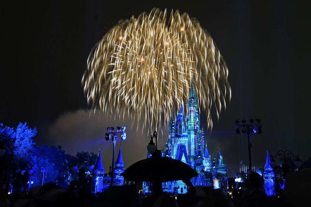 After a shutdown because of the coronavirus, fireworks fill the sky for the first time in 15 months at the Magic Kingdom at Walt Disney World Thursday, July 1, 2021, in Lake Buena Vista, Fla. (AP Photo/John Raoux)