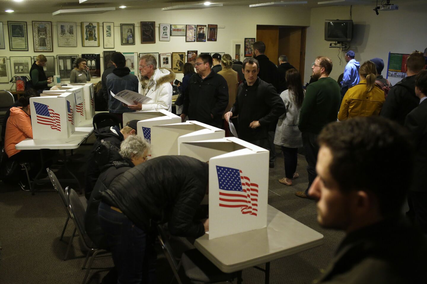 Voters fill out their ballots at a polling station in Des Moines.