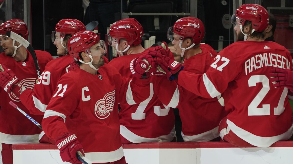 Detroit Red Wings center Dylan Larkin (71) celebrates his goal against the Tampa Bay Lightning in the first period of an NHL hockey game Thursday, Oct. 14, 2021, in Detroit. (AP Photo/Paul Sancya)