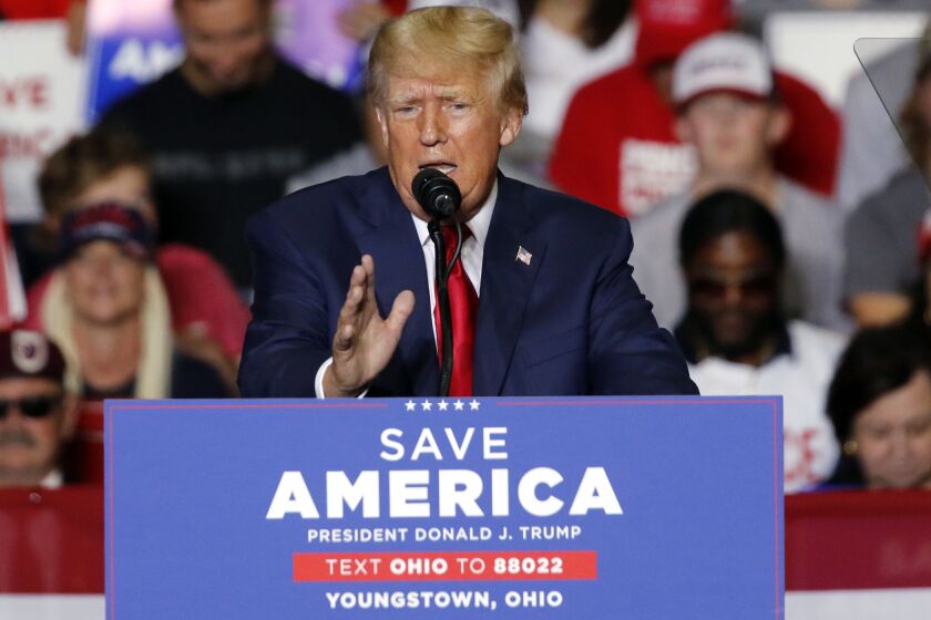 FILE - Former President Donald Trump speaks at a campaign rally in Youngstown, Ohio., Sept. 17, 2022. Trump is finally opening his checkbook and reserving millions of dollars in airtime for ads to bolster his endorsed candidates in key midterm races just one month before Election Day. Trump’s newly-formed MAGA Inc. Super PAC has so far placed reservations in Pennsylvania, Ohio and Arizona, according to the ad tracking firm AdImpact. (AP Photo/Tom E. Puskar, File)