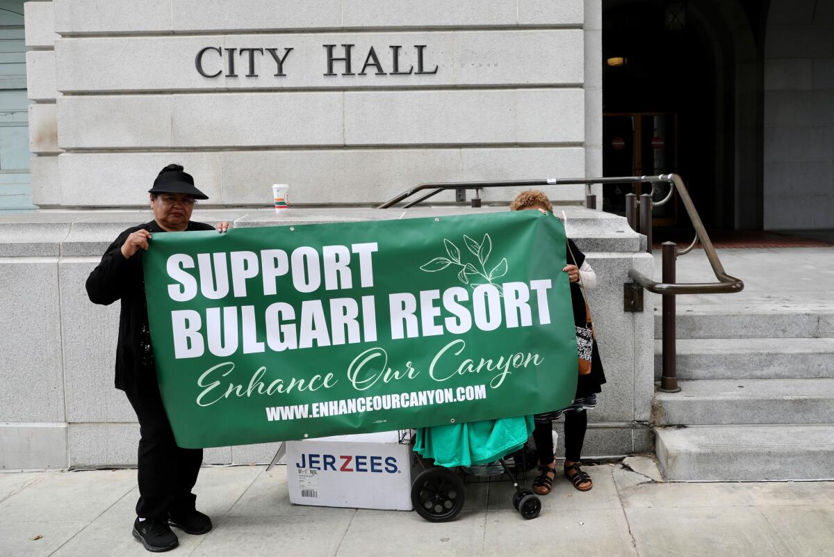 Supporters of the proposed Bulgari hotel project display a banner outside L.A. City Hall.