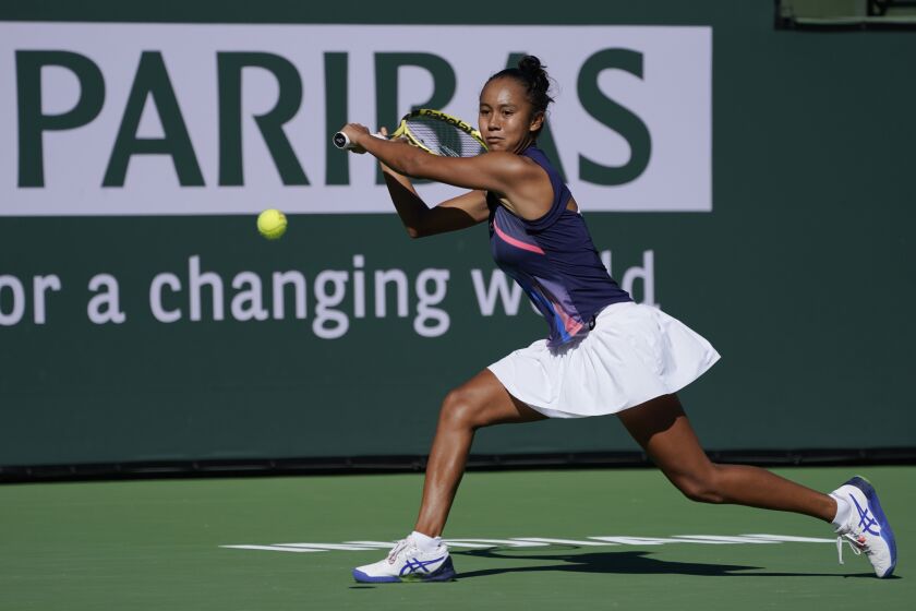 Leylah Fernandez, of Canada, returns a shot to Shelby Rogers at the BNP Paribas Open.