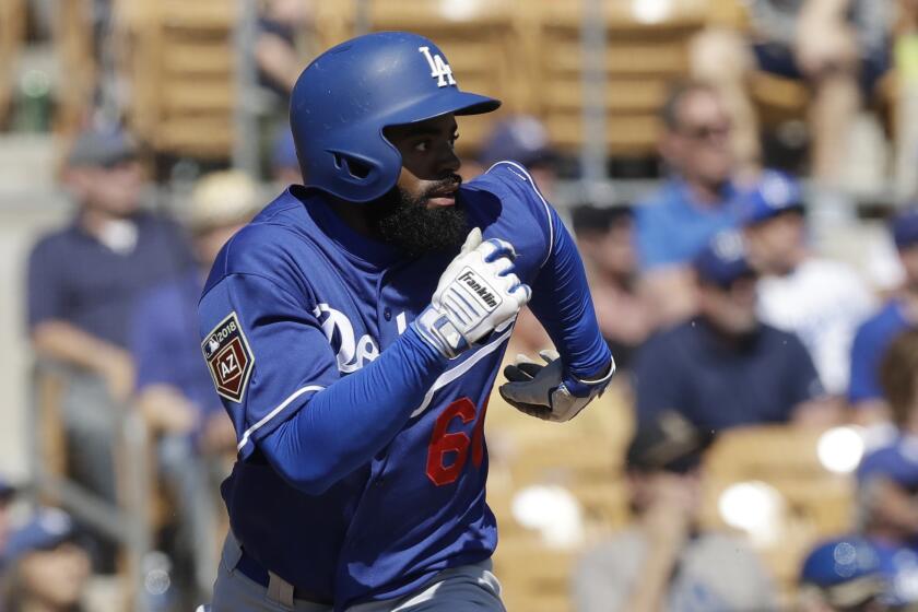 Los Angeles Dodgers' Andrew Toles runs to first during the second nning of a spring training baseball game against the Chicago White Sox, Friday, March 2, 2018, in Glendale, Ariz. (AP Photo/Carlos Osorio)