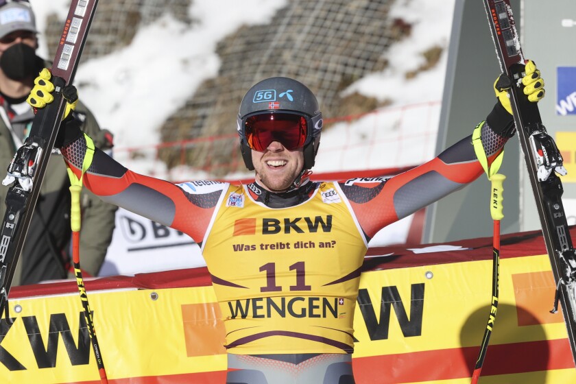 Norway's Aleksander Aamodt Kilde celebrates at the finish area of an alpine ski, men's World Cup downhill race, in Wengen, Switzerland, Friday, Jan. 14, 2022. (AP Photo/Luciano Bisi)