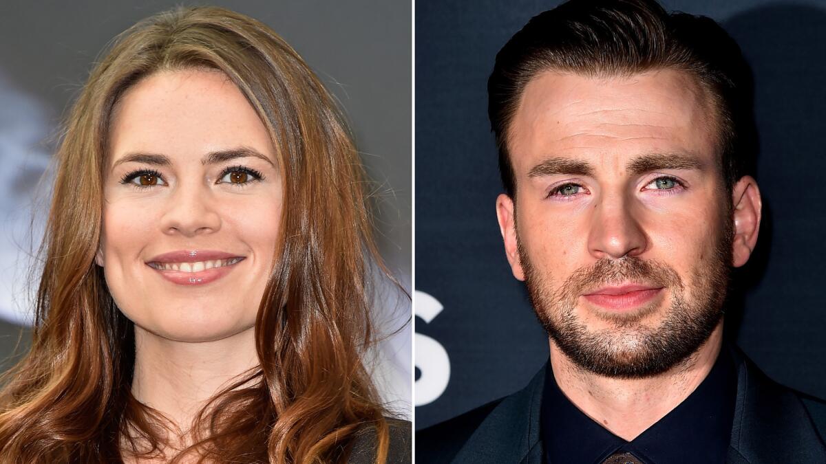 Hayley Atwell and Chris Evans looked almost as surprised as the bride-to-be did when a Saturday photo opp turned into a proposal at Salt Lake Comic Con in Salt Lake City.