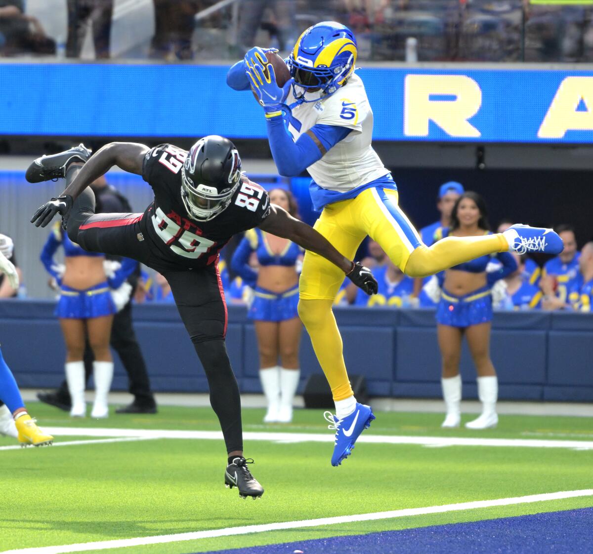 The Rams' Jalen Ramsey intercepts a pass in the end zone behind Falcons' receiver Bryan Edwards in the fourth quarter.