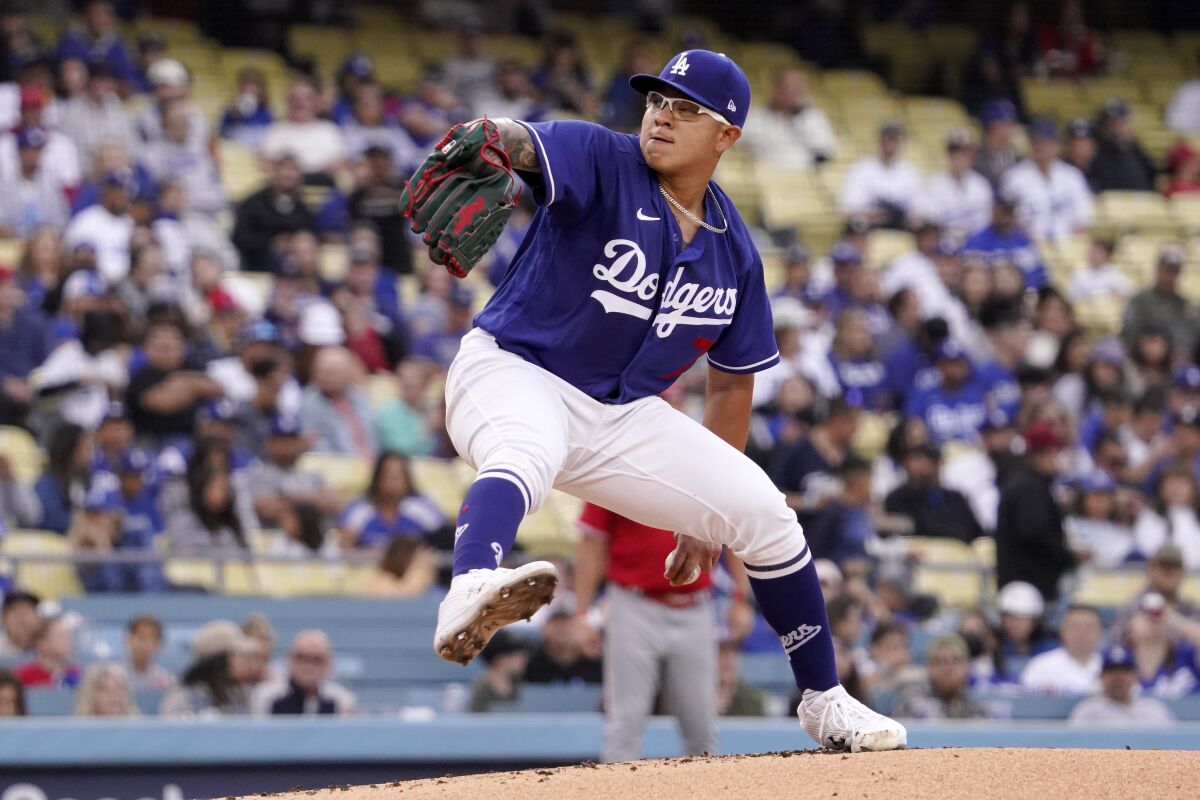 Los Angeles Dodgers starting pitcher Julio Urias throws to the plate during the first inning of a spring training baseball game against the Los Angeles Angels Monday, April 4, 2022, in Los Angeles. (AP Photo/Mark J. Terrill)