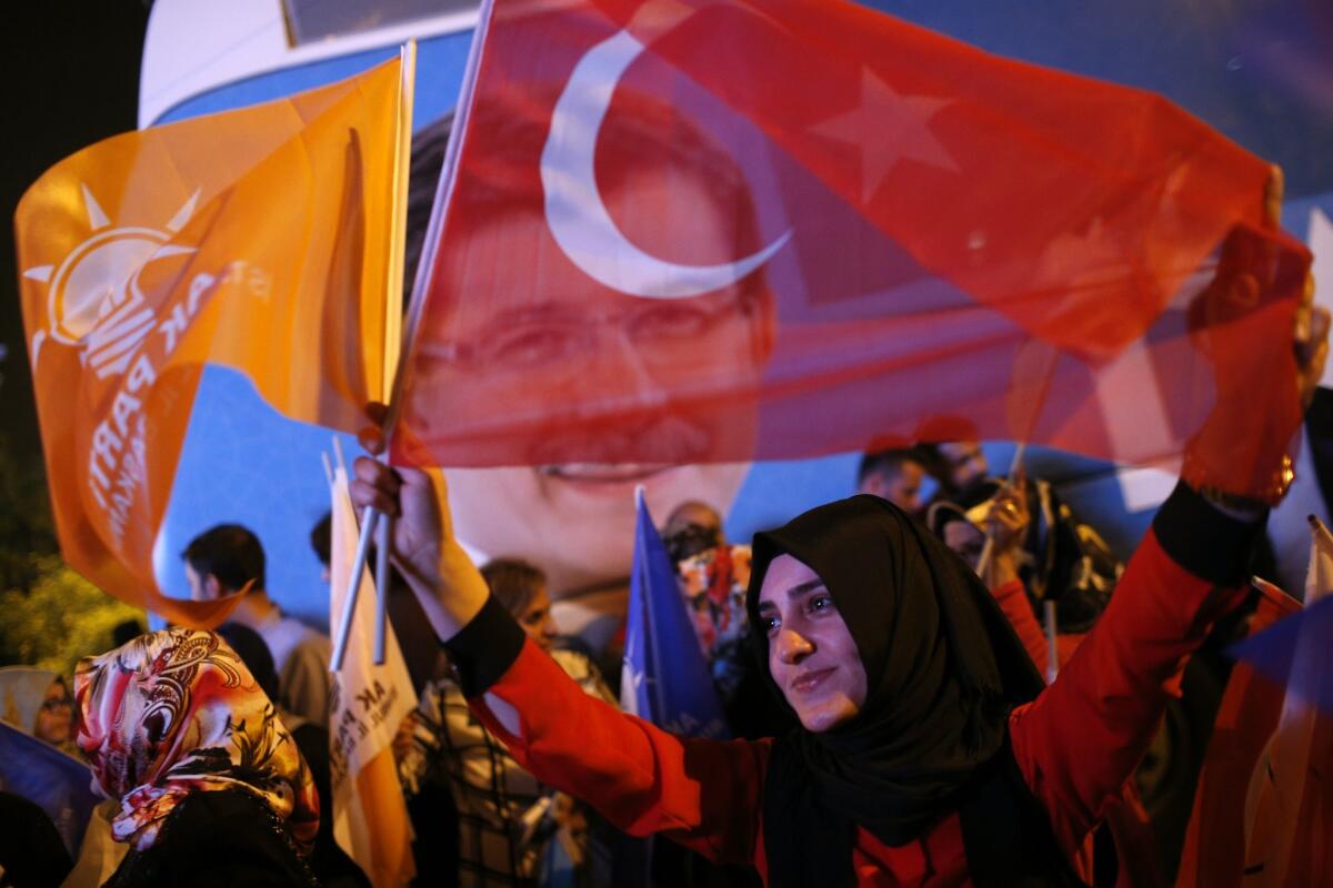 Supporters of Turkey's ruling Justice and Development Party rally in Istanbul following voting on June 7.