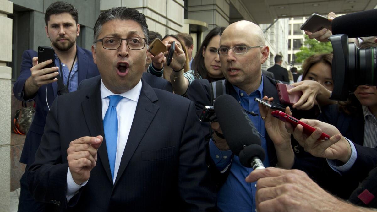 Assistant Atty. Gen. Makan Delrahim, who tried unsuccessfully to block the AT&T-Time Warner merger, speaks to reporters as he leaves the federal courthouse Tuesday following a judge's ruling against the Department of Justice.