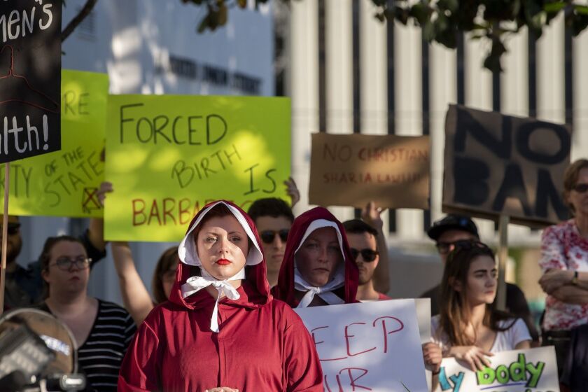 Margeaux Hartline, dressed as a handmaid, during a rally against HB314, the near-total ban on abortion bill, outside of the Alabama State House in Montgomery, Ala., on Tuesday May 14, 2019. (Mickey Welsh/The Montgomery Advertiser via AP)