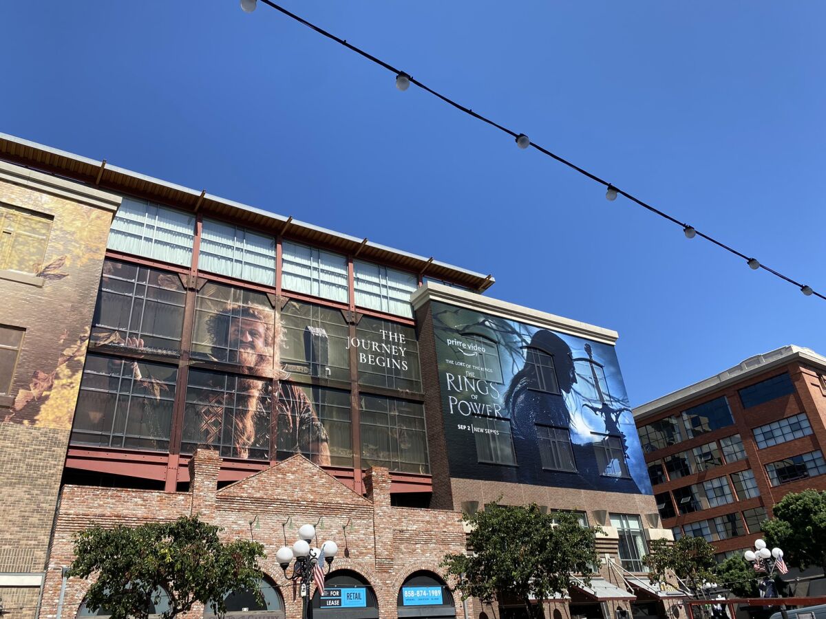 An advertisement for Prime Video's upcoming "The Rings of Power" series on a building.