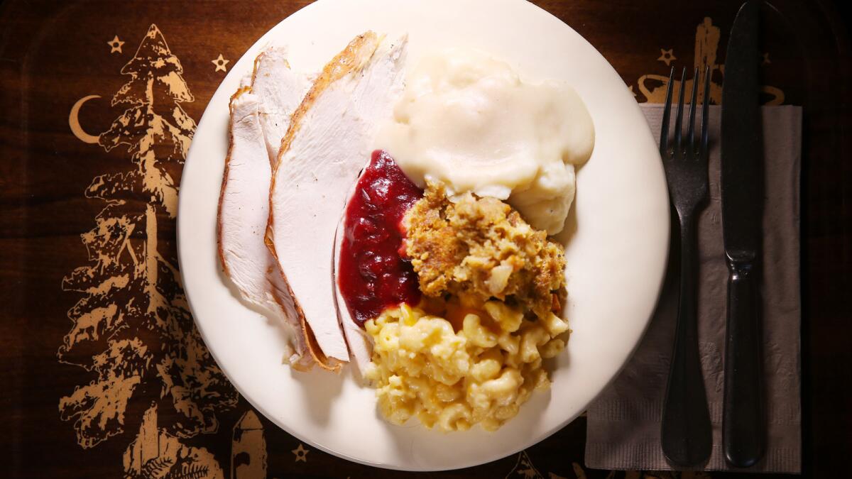 A plate full of turkey, mashed potatoes, gravy, stuffing and mac and cheese at Clifton's cafeteria in downtown L.A. The restaurant is open on Thanksgiving.