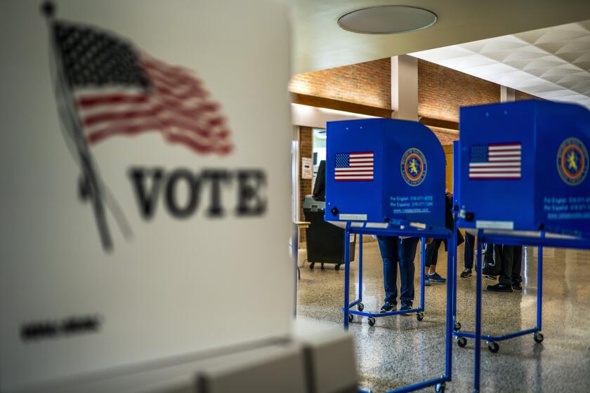 FILE - A voting center is pictured during early voting in the states' presidential primary election, March 26, 2024, in Freeport, N.Y. Even before President Joe Biden's withdrawal from the 2024 presidential race, allies of former President Donald Trump floated the possibility of suing to block Democrats from having anyone other than Biden on the ballot in November. But election administration experts say the timing of Biden's exit makes it unlikely that any Republican ballot access challenges will succeed, with some calling the idea "ridiculous" and "frivolous." (AP Photo/Eduardo Munoz Alvarez, File)