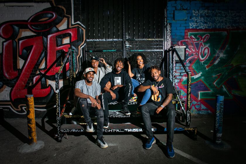 LOS ANGELES, CA - JUNE 15: Organizers of a downtown Juneteenth block party, Left to right: Malachi Fuller, Naydea Davis, Brian Henry, Lulit Solomon and Davon Johnson, pose for a portrait at the outdoor venue where they will be throwing a huge Juneteenth block party on Tuesday, June 15, 2021 in Los Angeles, CA. (Jason Armond / Los Angeles Times)