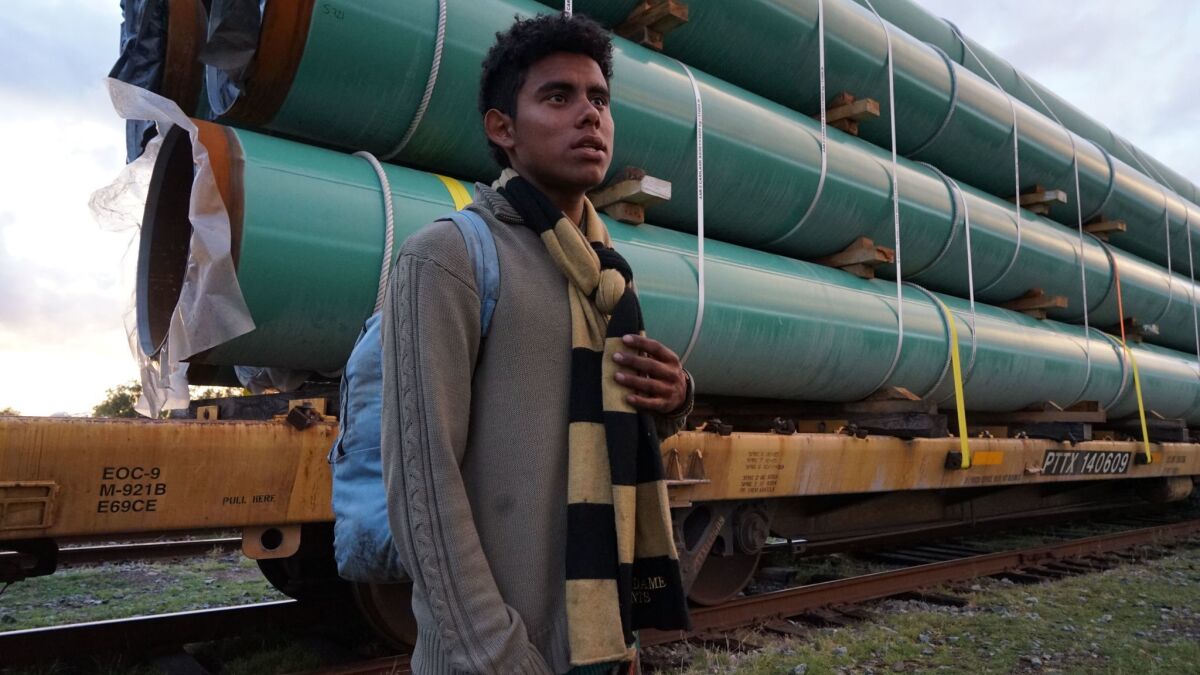Besser Geovanny Zelaya Ortiz, in a rail yard about 100 miles south of Nogales, Mexico, hoping to reach Gilroy, Calif.