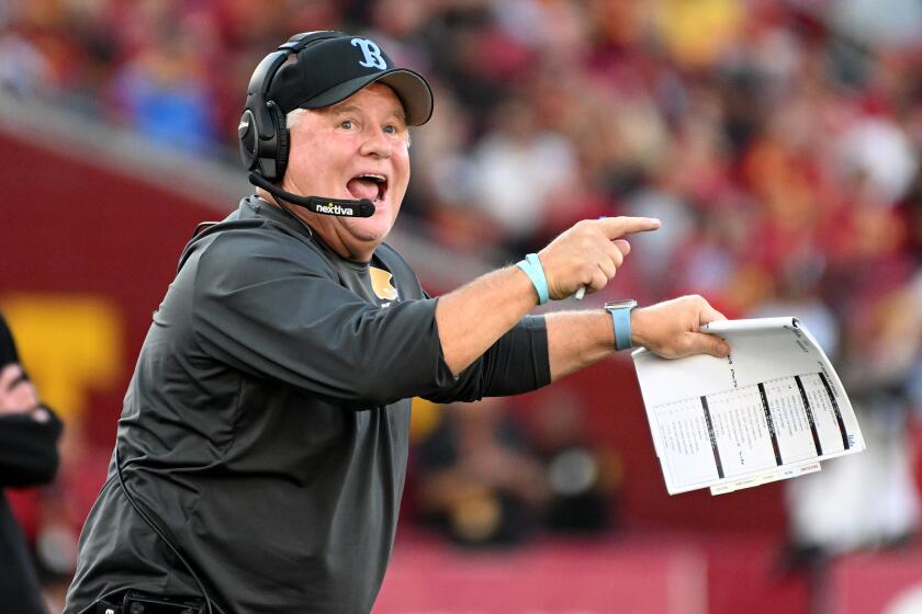 UCLA coach Chip Kelly gestures during the Bruins' win over USC at the Coliseum on Nov. 18.