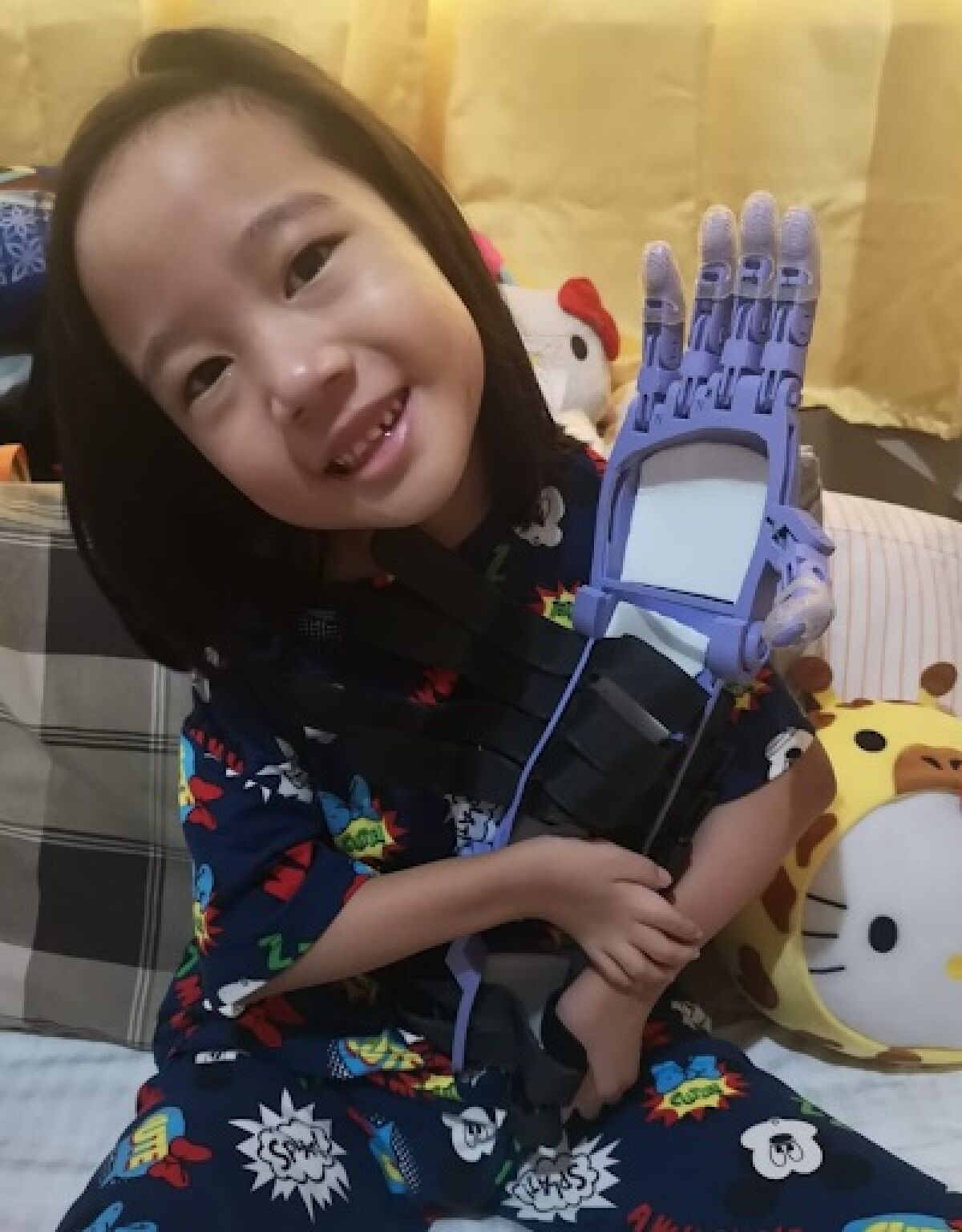 Ellie with the with the custom, 3D-printed arm.